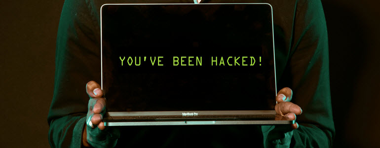You been hacked message on laptop.